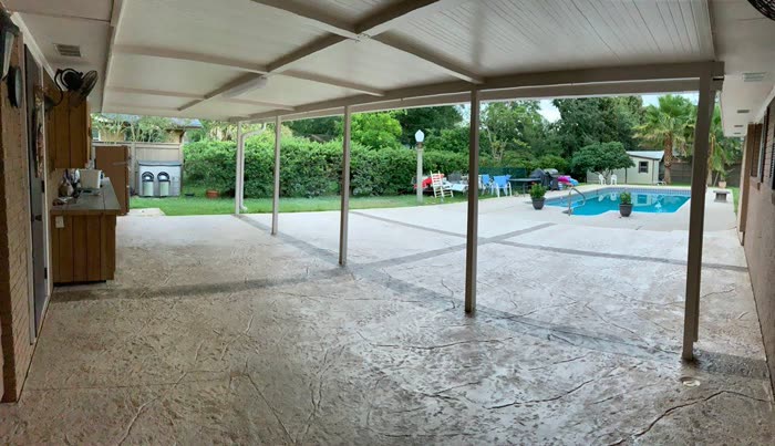 Finished concrete pool deck by Decorative Concrete Designs